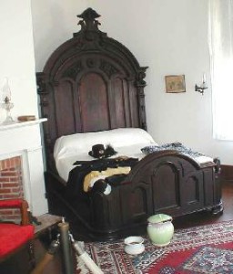 The bedroom at the Drum Barracks offers a glimpse of what living quarters were like for high-ranking officers during the Civil War. The bed is made of dark walnut and stands nine feet tall. LFP photo